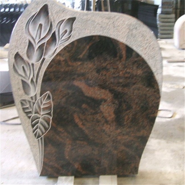 Granite headstone with  carved flowers